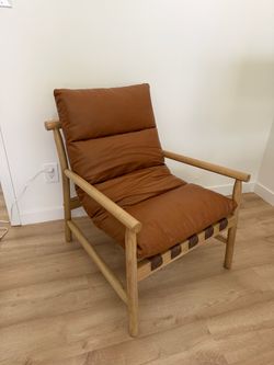 Midcentury brown leather and wood accent chair