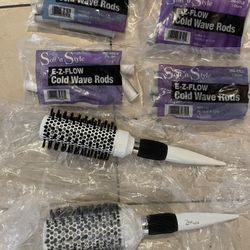2 Putt Style hair brushes and  Ez flow cold wave rods 