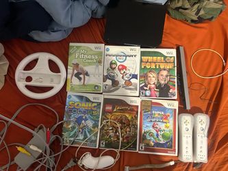 Nintendo wii with 6 games 2 controller