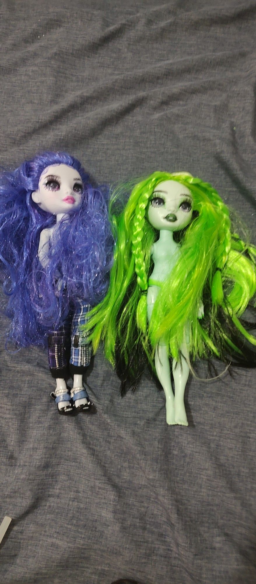 Two Dolls And A Bag With Random Clothes