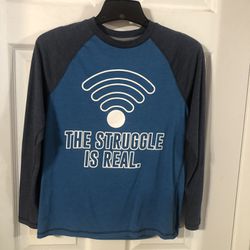 Boys Size Large 14 / 16 Long Sleeve Tshirt .  The Front says “The Struggle Is real”.  Preowned Good Condition 