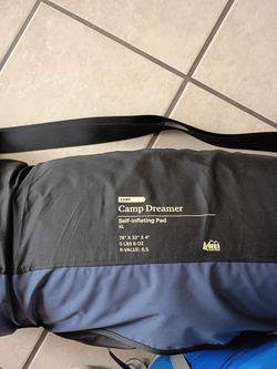 REI sleeping bag and thick foam mat