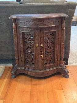 Intricately carved inlaid rosewood cabinet