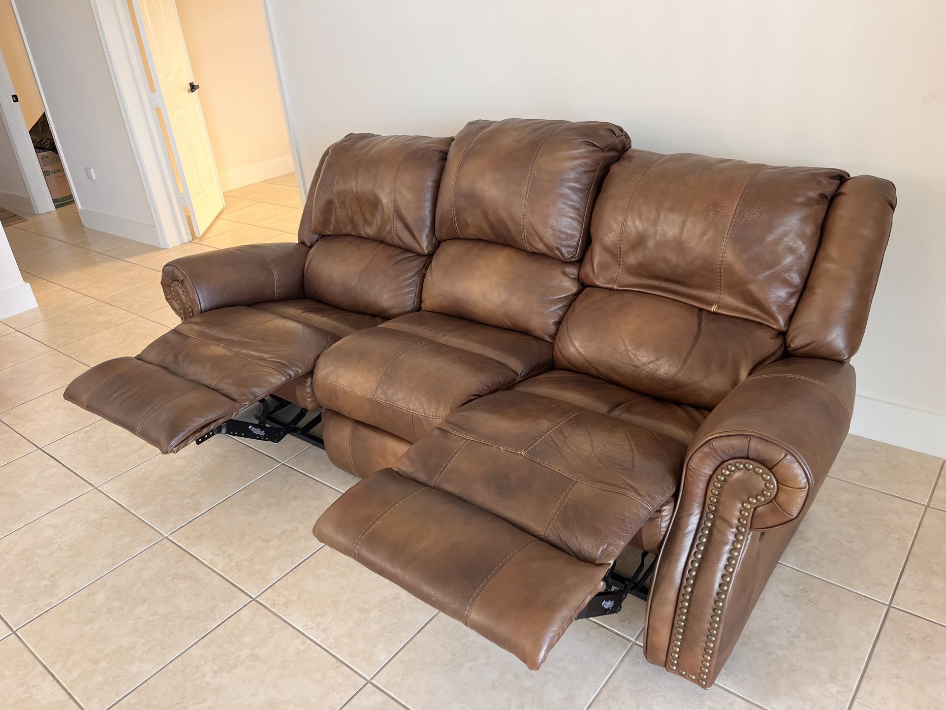 2 Recliner Sofas In Good Condition.