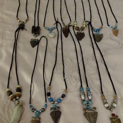 Handmade arrowhead necklaces adorned with tiger eye, beads, etc. The Bear Claw has SOLD.. 