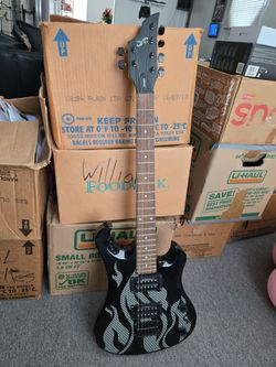 Guitar or bass  electric.  First act brand