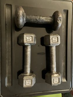 A set of Three Five Pound Dumbbells