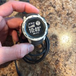 Garmin Instinct GPS watch and Charger