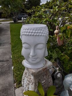 Large pottery Buddah head plant stand or garden stool