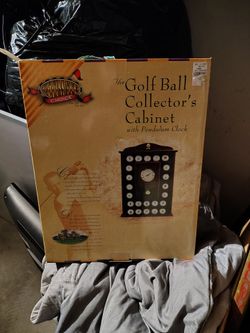 Golf ball collector cabinet with clock