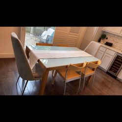 Glass Top Dining Table with 4 black leather chairs 