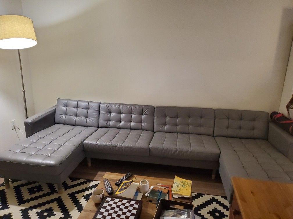 IKEA leather couch pristine condition. 2 chaise loungers on each side with matching ottoman