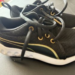 Puma Black and Gold Sneakers with Curved Stripe Design