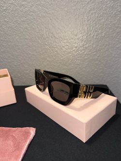Luxury sunglasses (Miu Miu)