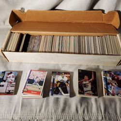 box set of baseball, hockey, football and basketball cards.