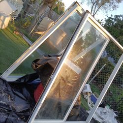 5 feet Wide 6 Feet Tall Double Pane Glass Vinyl Windows Both Have Complete Window But Both Need Screens 
