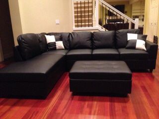 New black leather sectional sofa with storage ottoman and two free pillows! Deliver today