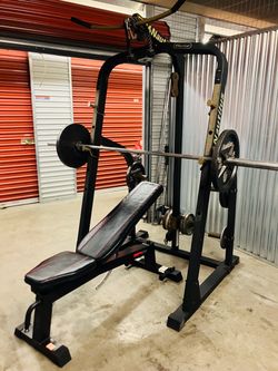 Nautilus squat rack w/ weight loaded upper and lower pulley systems 235lb’s of weights including bar