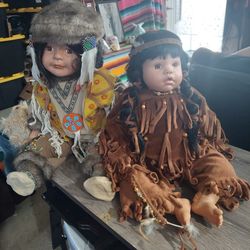 I AM Selling  These Two  Native Porcelain Dolls In Good Condition 