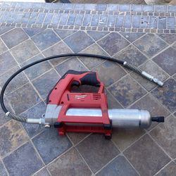 Milwaukee new display model 12v Lithium ion cordless grease gun ( tool only)