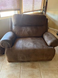 Oversized Brown Armchair and Couch with Nailhead Trim