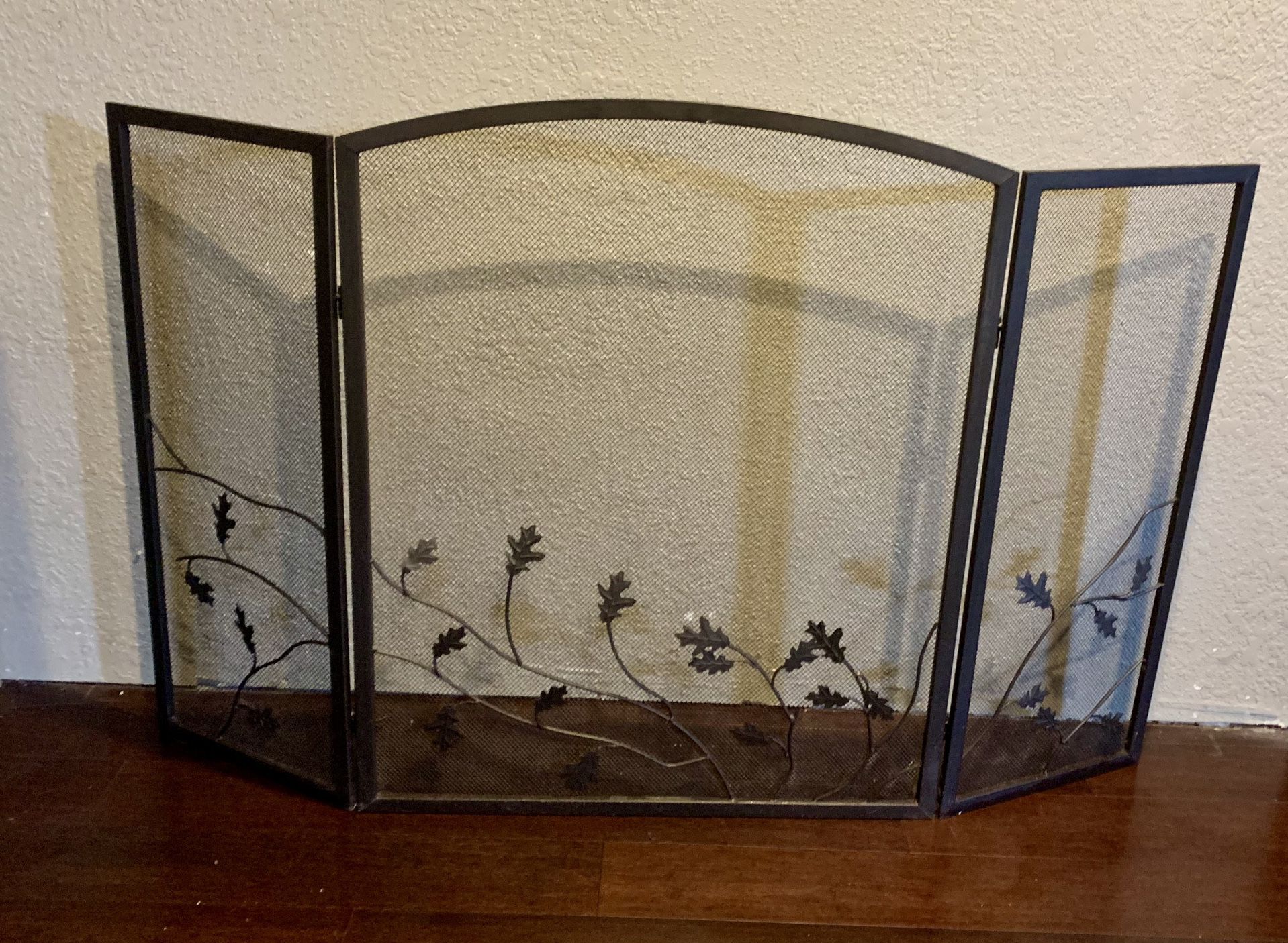 Metal Fire Place Screen With Scrolling Leaf Design Across The Front 