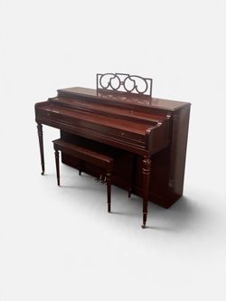 Cable-Nelson console studio upright piano with a mahogany finish