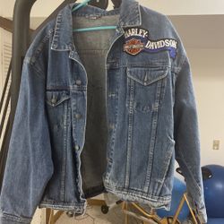 Extra large blue Jean jacket with Harley patches on it