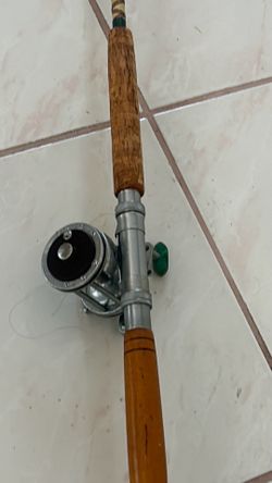 Vintage Penn Fishing reel and South Bend Fishing pole deep sea