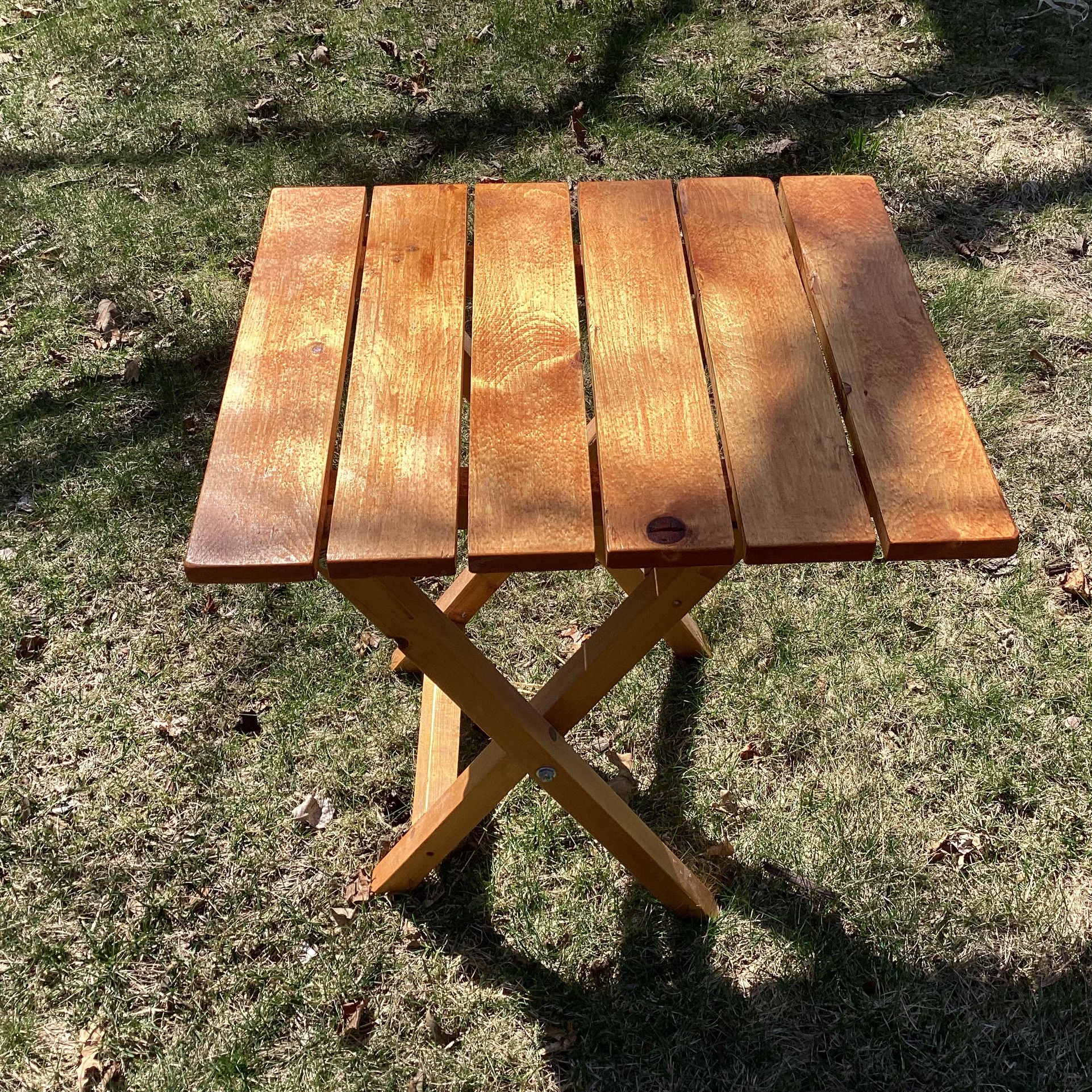 Slatted all light wood folding table small 22.5 deep- 25.25 tall- 20 wide Has lock to make sturdy use indoor or outdoor like brand new