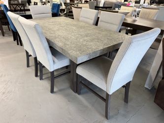 7-Piece Faux Marble Dining Set – $999.99 + Tax