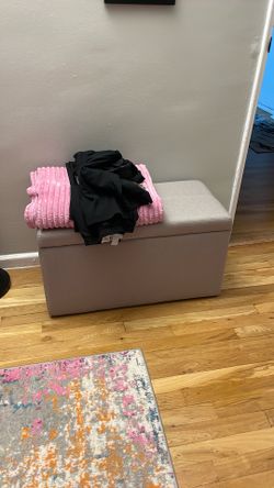 Small storage ottoman in beige color