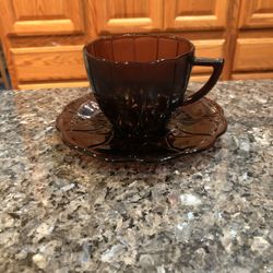 Vintage Pretty Hazel Atlas Newport Amethyst Depression Glass Cup and saucer .  Saucer Size 3 1/4 inches Tall .  Size of Cup. 2 3/4 inches tall and 3 1