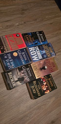 Seven John Grisham paperbacks