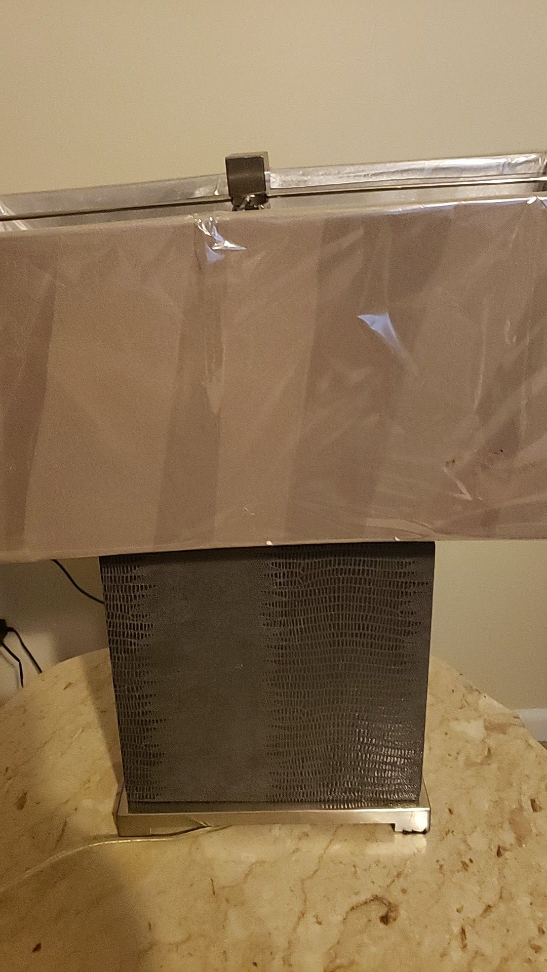 2 identical lamps Dark with matching shade gray. still has platic from original purpose very conservative
