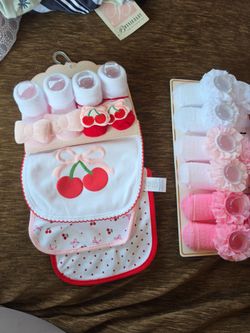 Brand new socks, headband, and bibs