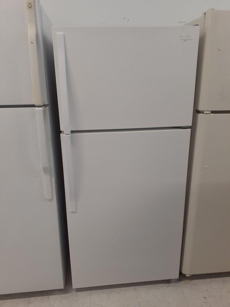 Whirlpool top freezer refrigerator in good condition with 90 day's warranty