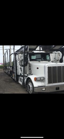 NECESITO PARQUEO PARA DOS CAR CARRIER 