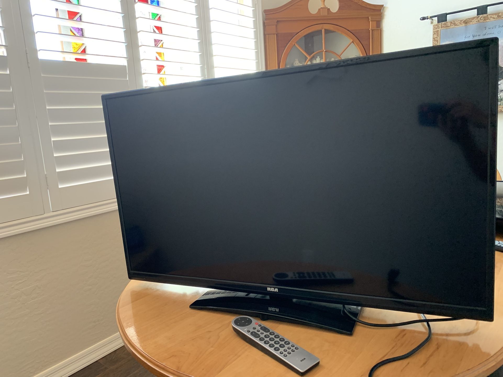 RCA 40” LED LCD Full HDTV TV with Stand, Power Cord, and Remote.