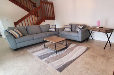 Two Clean Couch, King Size Bed ,TV Stand and Coffee table and Dinner Room Table