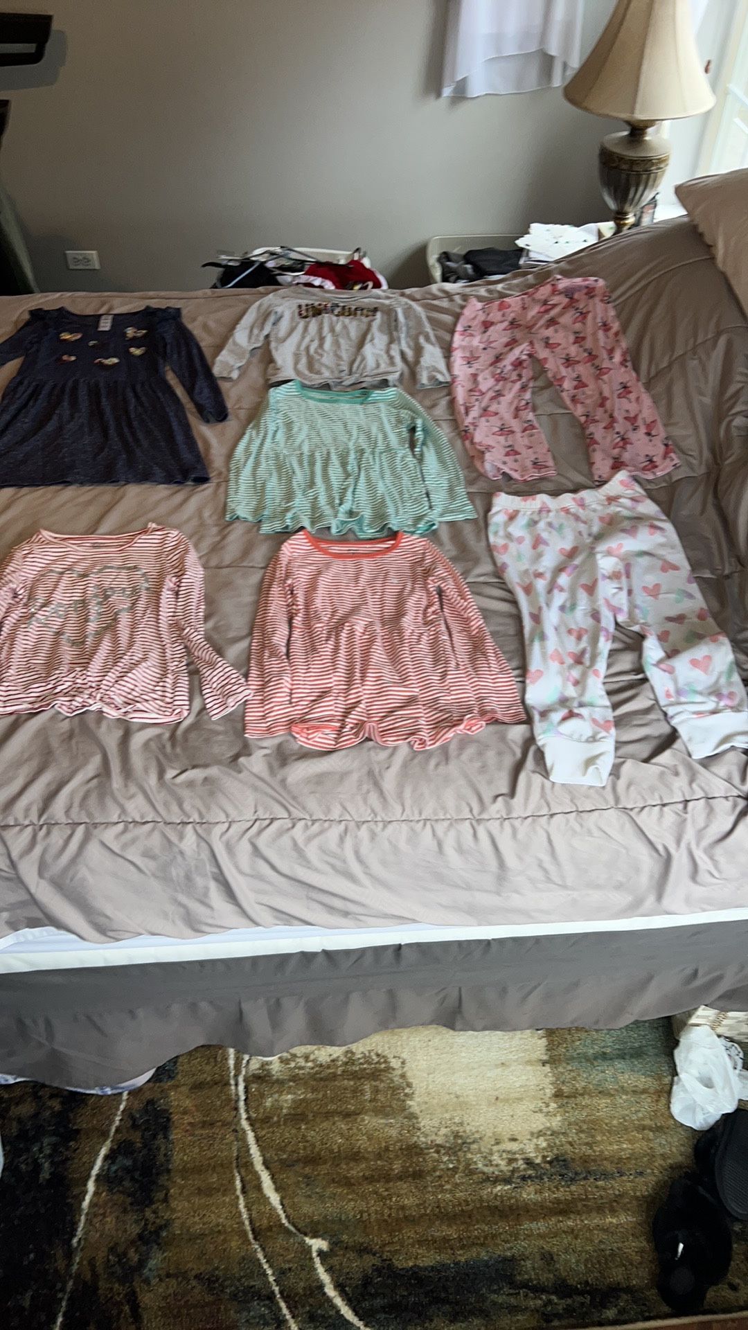 Carters girls 6/6x clothes. Pj pants have stains/piling. Bonjour & unicorn shirts have light stains. Blue dress has a light stain a & tiny snag.