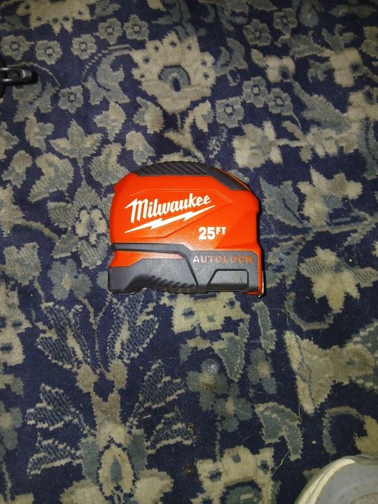 This is a Milwaukee 25ft Compact Auto-Lock Tape Measure