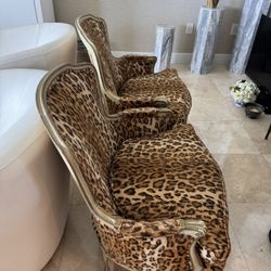 Pair Of French Louis XV style bergère armchairs upholstered in a leopard print velvet