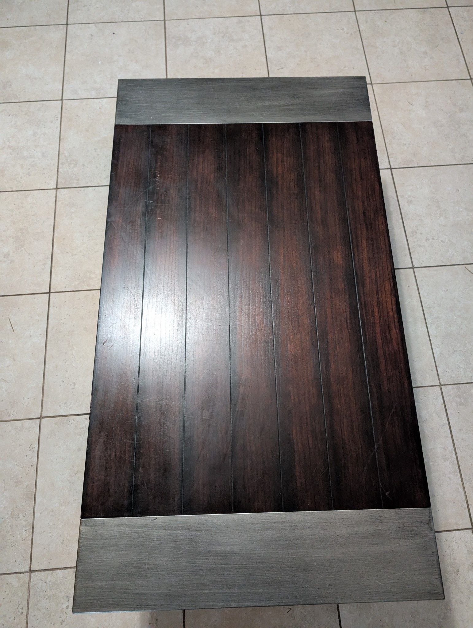 Wood coffee table with metal ends