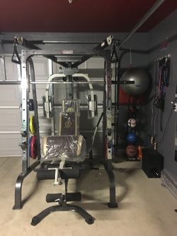 Used Smith Cage With Colored Weight Plates