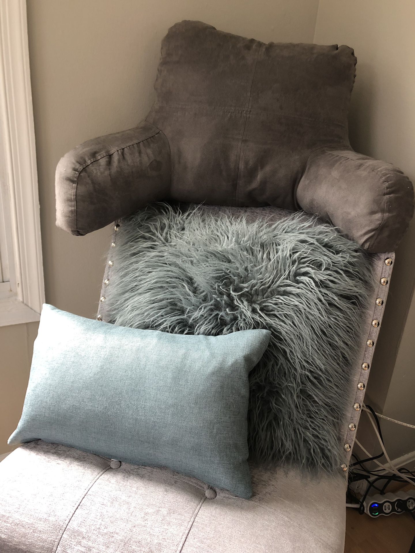 2 decorative pillows and a backrest pillow