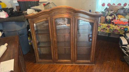 Glass cabinet and wood cabinet used separate  or together . Best offer possible pick up only