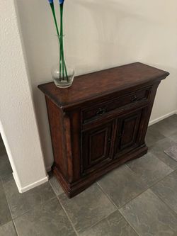 Dark Wood Cabinet with Drawers and Doors