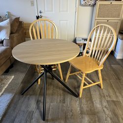 table and two solid wood chairs 