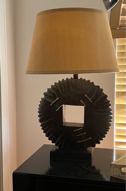 Rustic Carved Disc Table Lamp with Tan Fabric Drum Shade